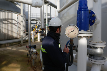 Pressure gauge at gas plant - measuring gas pressure - pipe and valve - obrazy, fototapety, plakaty