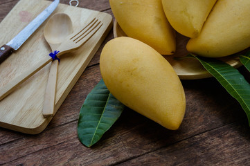 sweet yellow mango fruit  on wood table , ready to eat for healthy , fruit on summer