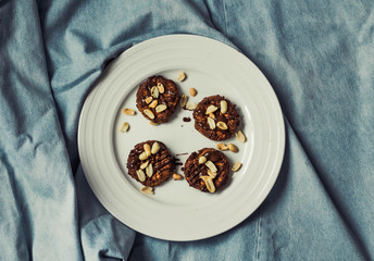 Beautiful Christmas background cookies and cap of coffee on blue background. Space for text.Top view.