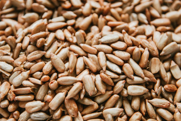 close - up of peeled sunflower seed background texture, top view flat lay