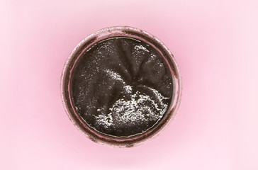 Natural scrub on soft pink pastel background.