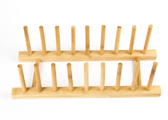 Wooden natural color rack for holding pot/pan lids in kitchen isolated on white, studio shot. Kitchen organizer interior element tool concept.