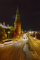 Fototapeta premium Tower of Moscow Kremlin and Kremlevskaya embankment at night. Urban landscape