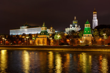 Fototapeta na wymiar Architecture of Moscow Kremlin at night with reflection of night illumination on surface of Moskva river