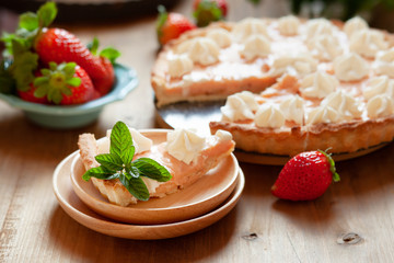 Strawberry tart cake decorated with whipped cream and fresh berries. Summer dessert pie