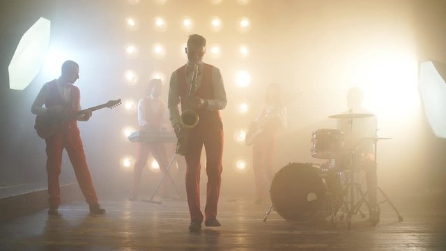 Emotional musician with sax during the concert. Enjoyment. people, star concept