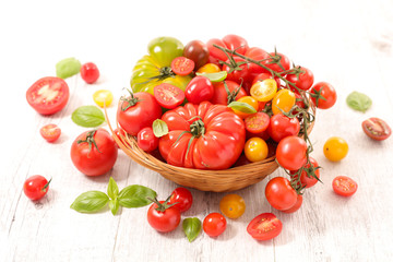 assorted various tomatoes and basil