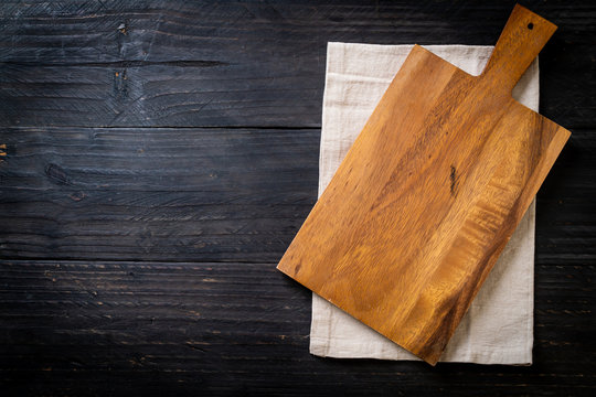 empty cutting wooden board with kitchen cloth