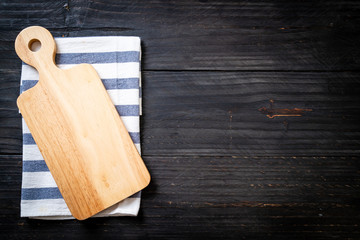 empty cutting wooden board with kitchen cloth
