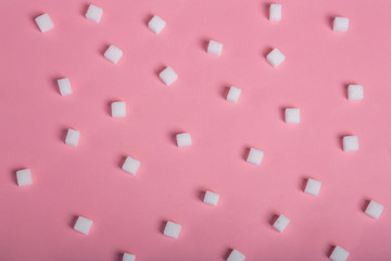 sugar sweet food. Sugar cubes - unhealthy diet concept. Cubes of sugar on pink background. Empty...