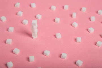 sugar sweet food. Sugar cubes - unhealthy diet concept. Cubes of sugar on pink background. Empty...