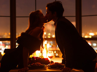 Silhouette of kissing couple