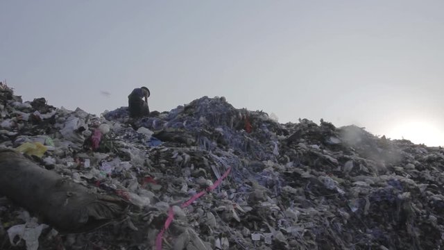 Illegal migrant worker in rubbish dump site in Mae Sot, Thailand.