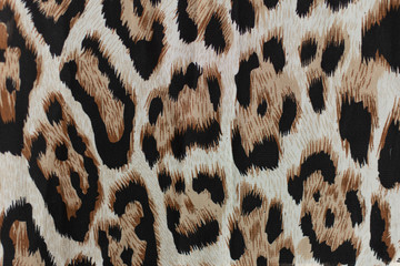Leopard fablic texture. Fashion textile background.