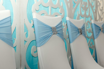 wedding white and blue chairs with ribbon