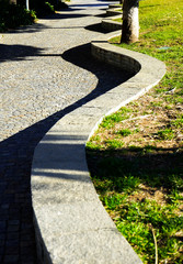 detail of a winding path in a promaade
