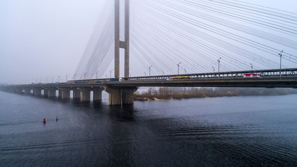 Bridge in the fog. Aerial view of South subway cable bridge. Kiev, Ukraine.