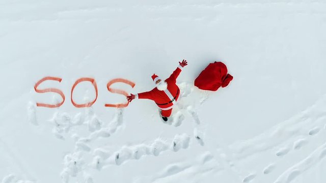 Snow wides and Santa Claus expressing SOS-signals 