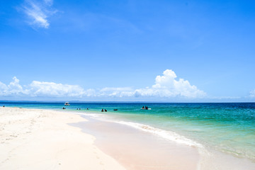 Fototapeta na wymiar Tropical island, idyllic beach with some tourists, Caribbean sea