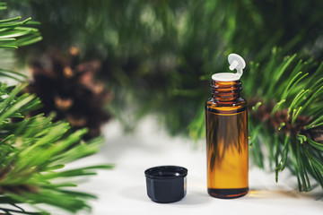 small bottle of essential pine tree oil