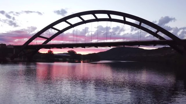 360 Penny Backer Bridge over Lake Austin during sunset.