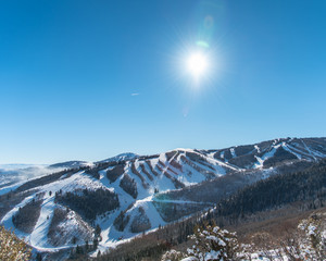 Sunny view of a ski resort.  View of ski resort in Utah in the winter season.