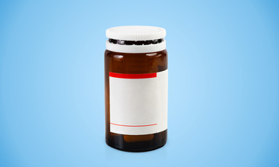 Dark glass bottle with blank label and capsules inside