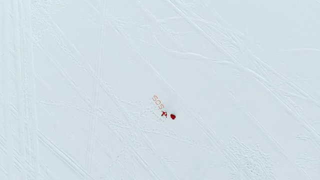 View from a massive height on Santa Claus calling for help