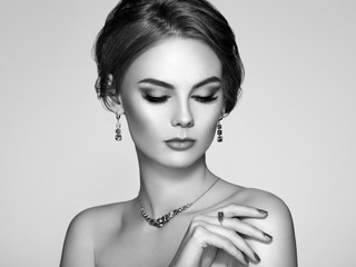 Portrait Beautiful Woman with Jewelry. Model Girl with Magnificent Manicure on Nails. Elegant...