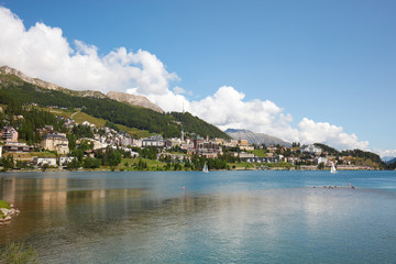 Fototapeta na wymiar Sankt Moritz town and lake in a sunny summer day in Switzerland