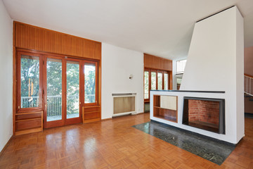 Old living room, apartment interior with fireplace in old house with garden
