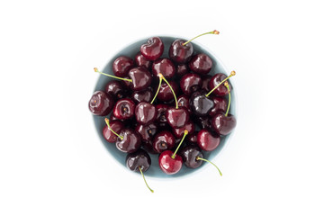 Top View of a Bowl with Cherries on White Background