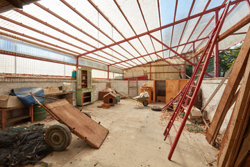 Fototapeta premium Messy deposit with plastic roof in old country house
