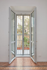New double glazed open window with gate in white, renovated apartment