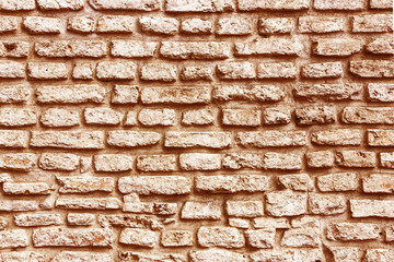 Mosaic stones construction backdrop. Grunge uneven brick wall pattern. Pieces of cracked blocks in concrete wall background.	