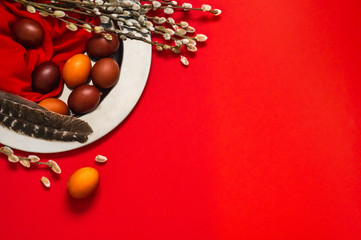 Happy Easter card. Cute Red Easter eggs with feathers and willow seals in iron plate. Happy Easter