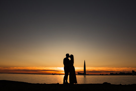 silhouette of couple at sunset