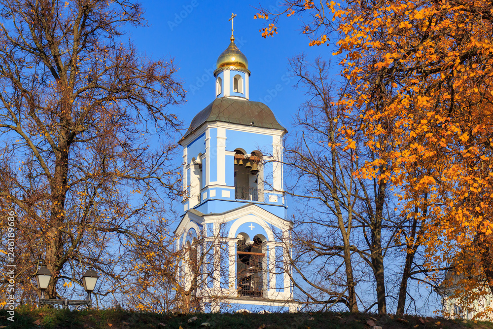 Wall mural Church of the icon of the mother of God Life-giving spring in Tsaritsyno park in Moscow against blue sky at sunny autumn day