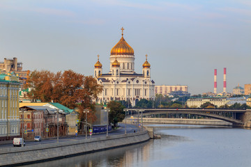 Cathedral of Christ the Saviour in Moscow on a background of Moskva river embankment in sunny autumn morning