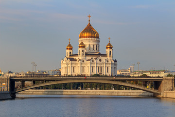 Cathedral of Christ the Saviour in Moscow against Moskva river and Bolshoy Kamennyi Bridge in sunny autumn morning