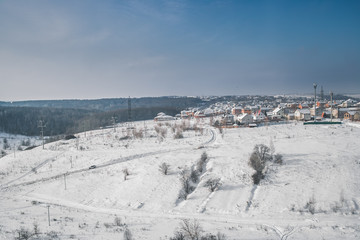 Fototapeta na wymiar Panoramic view of the winter town from the air