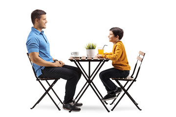 Father and son at a coffee table