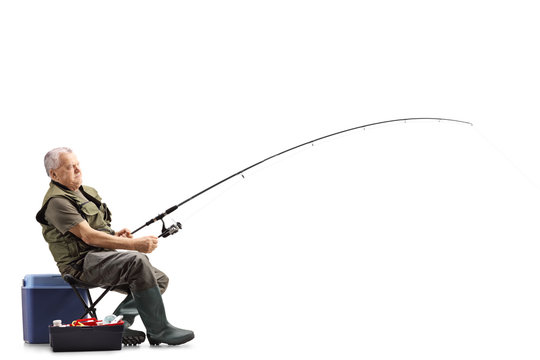 Fisherman on a chair with a fishing rod waiting for a catch