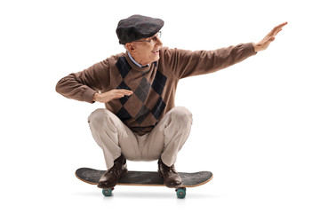 Energetic senior man riding a skateboard © Ljupco Smokovski