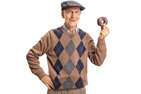 Cheerful senior man holding a chocolate donut
