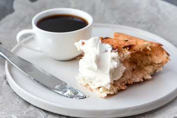 Coffee and bread with cream cheese