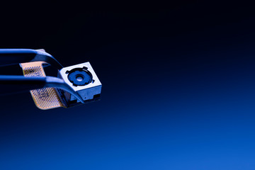 Use tweezers to hold digital spy camera