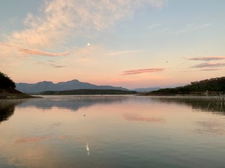 Pink, purple and orange hues in the sky over Lake El Salto, a famous bass fishing spot in Sinaloa, Mexico, at dawn