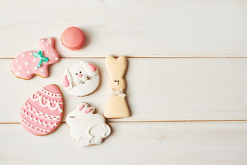 Closeup of colorful easter cookies on white background. Easter Postcard Template. Cookies in shape of eggs and Easter bunny. Happy Easter holiday background concept.Sweets for celebrate 