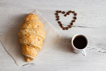 croissant and heart shaped coffee beans